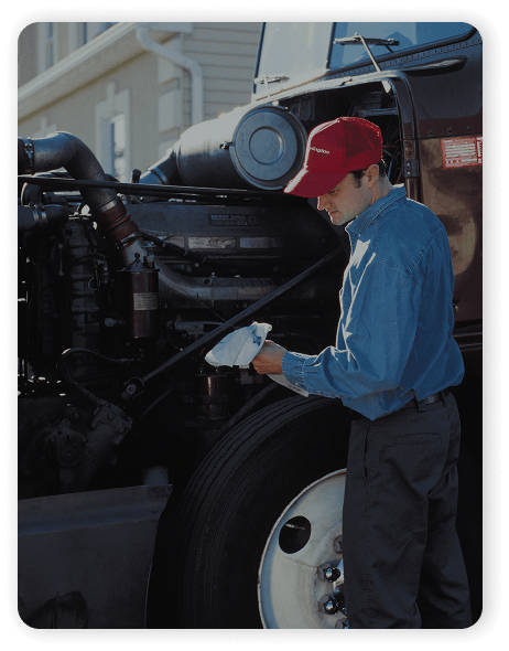 A man cleaning the front of a truck