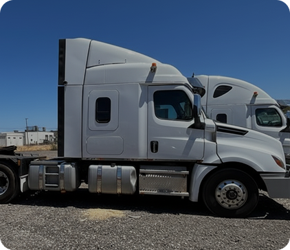 Side of a white prime mover truck